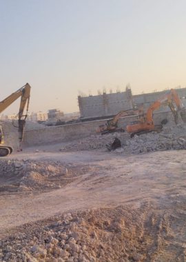 Excavators breaking rock during levelling works at Al Wukair, Qatar