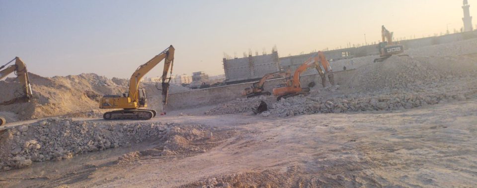 Excavators breaking rock during levelling works at Al Wukair, Qatar