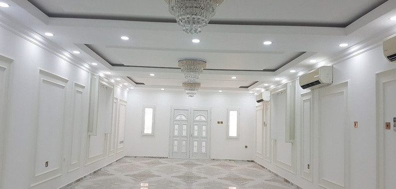 Completed villa reception with marble flooring and gypsum ceiling, Qatar