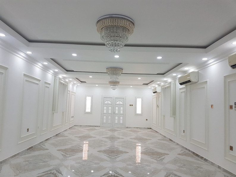 Completed villa reception with marble flooring and gypsum ceiling, Qatar